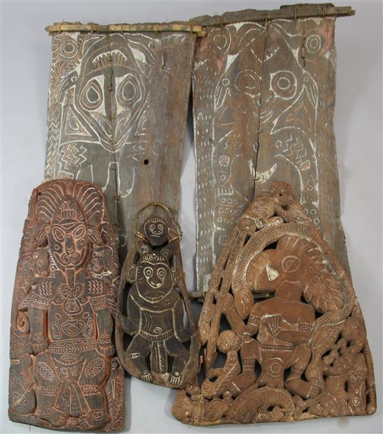 Three various Sepik River carved wood storyboards & two palm leaf paintings